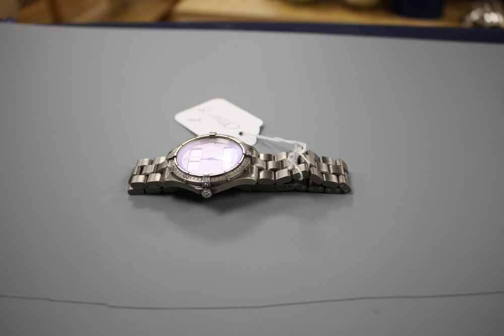 A gentlemans steel Breitling Aerospace quartz wrist watch, on Breitling bracelet.